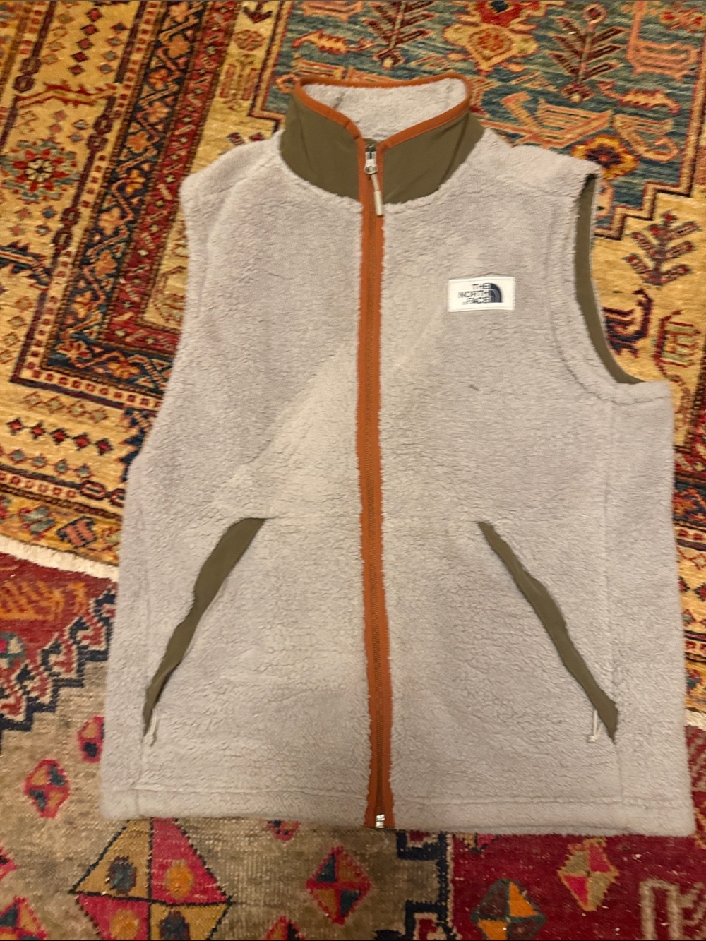 The North Face Men's Cream Sherpa Vest with Olive Trim and Rust Zip